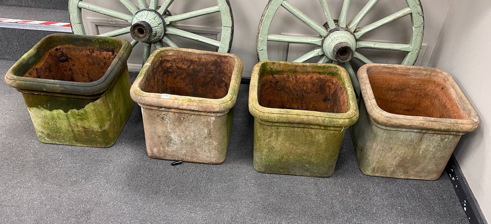 Four terracotta pots with lion's paw feet (two feet missing), width 46cm, height 38cm
